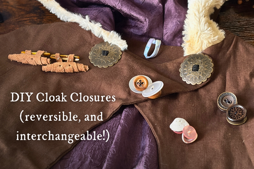 A close-up photo shows an Overland Cloak neckline laid on a table. A variety of double-sided, interchangeable closures for the cloak are laid out across it, with a title that reads DIY Cloak Closures (reversible and interchangeable!)